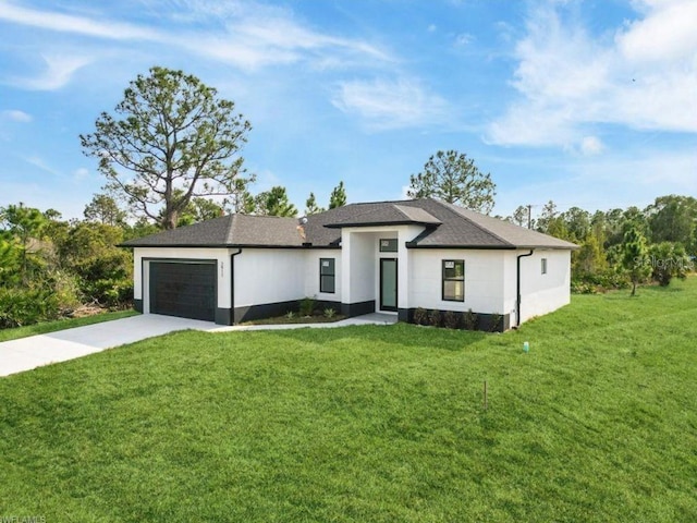 2911 37th St W, Lehigh Acres, FL 33971 - view of front of home with a garage, a front yard, concrete driveway, and roof with shingles