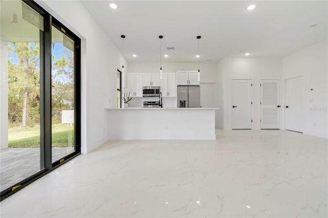2911 37th St W, Lehigh Acres, FL 33971 - unfurnished living room with healthy amount of natural light, recessed lighting, and light marble finish flooring
