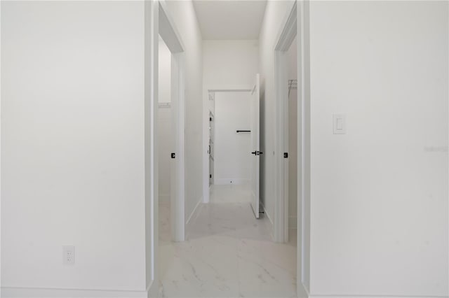 2911 37th St W, Lehigh Acres, FL 33971 - corridor featuring light marble finish floors and baseboards