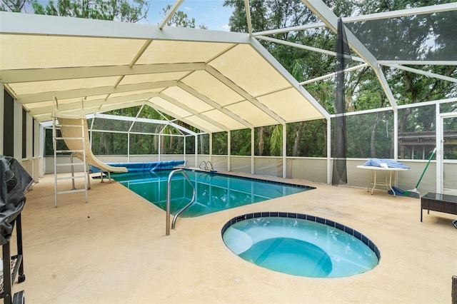 6605 NE Masters Ave, Arcadia, FL 34266 - swimming pool with an in-ground hot tub, a water slide, a lanai, and a patio