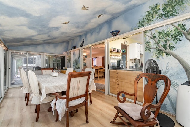 6605 NE Masters Ave, Arcadia, FL 34266 - dining room with light wood-style floors and lofted ceiling