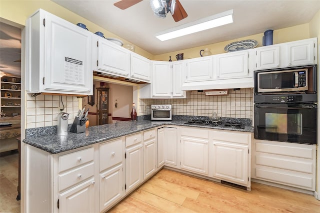 6605 NE Masters Ave, Arcadia, FL 34266 - kitchen with oven, gas stovetop, stainless steel microwave, a ceiling fan, and backsplash