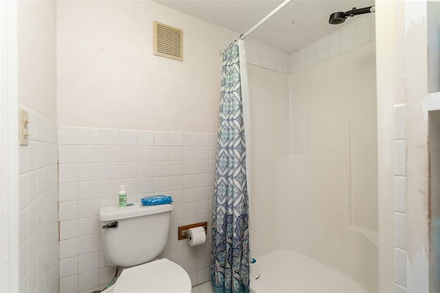 6605 NE Masters Ave, Arcadia, FL 34266 - bathroom with tile walls and a shower stall
