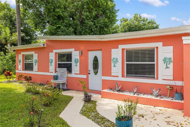 1027 Coral Ridge Dr, Punta Gorda, FL 33950 - view of front of home with stucco siding