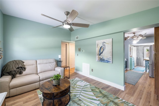 1027 Coral Ridge Dr, Punta Gorda, FL 33950 - living room with a ceiling fan and light wood-type flooring