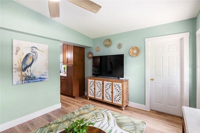 1027 Coral Ridge Dr, Punta Gorda, FL 33950 - living area with light wood-type flooring and ceiling fan