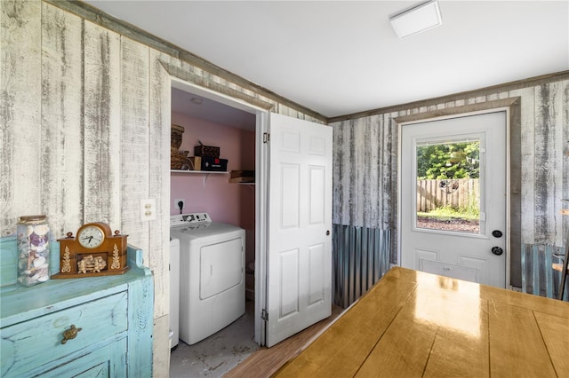 1027 Coral Ridge Dr, Punta Gorda, FL 33950 - laundry room featuring washer and clothes dryer and wallpapered walls