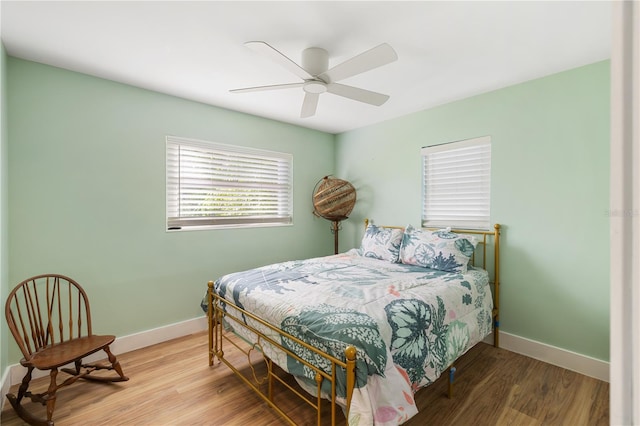 1027 Coral Ridge Dr, Punta Gorda, FL 33950 - bedroom featuring wood finished floors and a ceiling fan