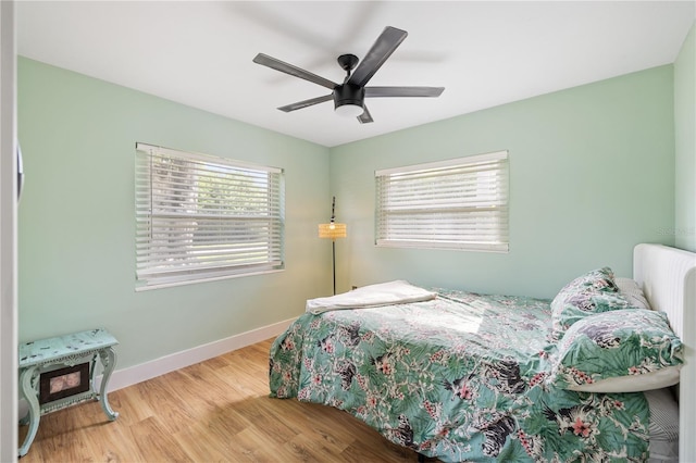 1027 Coral Ridge Dr, Punta Gorda, FL 33950 - bedroom with wood finished floors and a ceiling fan