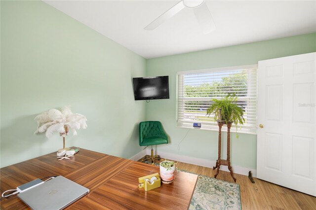 1027 Coral Ridge Dr, Punta Gorda, FL 33950 - home office with a ceiling fan and wood finished floors