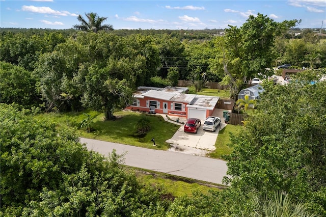 1027 Coral Ridge Dr, Punta Gorda, FL 33950 - view of subject property featuring a forest