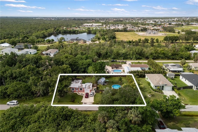 1027 Coral Ridge Dr, Punta Gorda, FL 33950 - aerial view of residential area featuring property parcel outlined and a large body of water