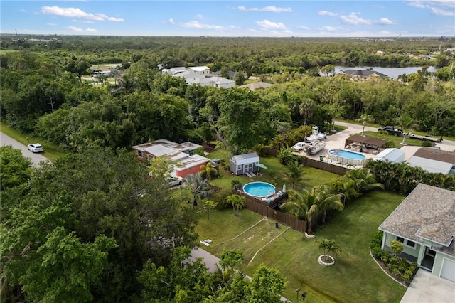 1027 Coral Ridge Dr, Punta Gorda, FL 33950 - aerial overview of property's location featuring a heavily wooded area and a pool area