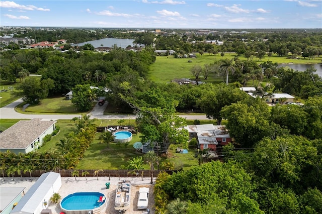 1027 Coral Ridge Dr, Punta Gorda, FL 33950 - bird's eye view of a pool area and a tree filled landscape