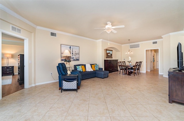 17454 Old Harmony Dr Unit 101, Fort Myers, FL 33908 - living area with ornamental molding, a ceiling fan, light tile patterned floors, arched walkways, and a chandelier