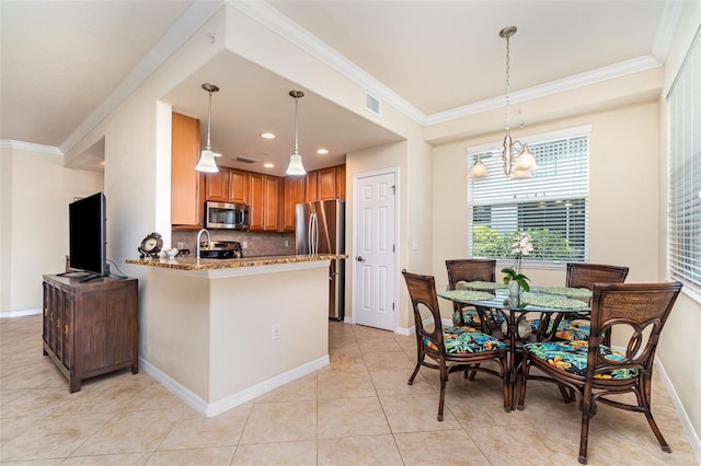 17454 Old Harmony Dr Unit 101, Fort Myers, FL 33908 - kitchen with appliances with stainless steel finishes, a peninsula, ornamental molding, a chandelier, and light tile patterned floors