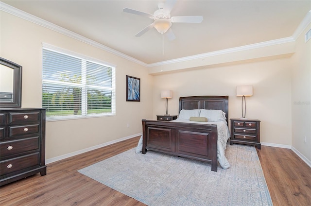 17454 Old Harmony Dr Unit 101, Fort Myers, FL 33908 - bedroom with crown molding, wood finished floors, and a ceiling fan