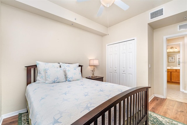 17454 Old Harmony Dr Unit 101, Fort Myers, FL 33908 - bedroom with a closet, light wood-style floors, and a ceiling fan