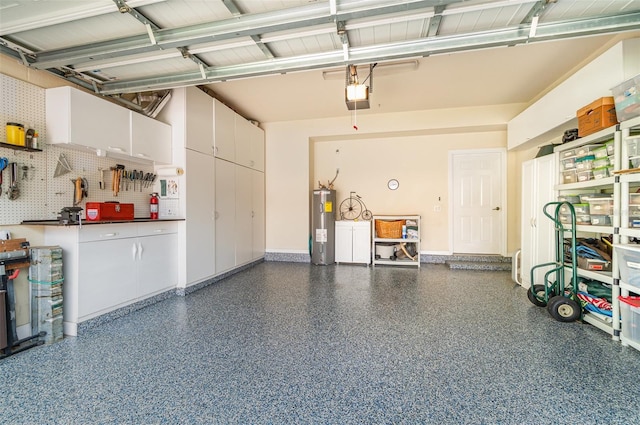 17454 Old Harmony Dr Unit 101, Fort Myers, FL 33908 - garage with a garage door opener and electric water heater