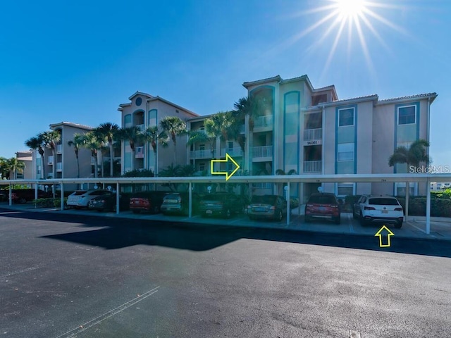 14061 Brant Point Cir Unit 7206, Fort Myers, FL 33919 - view of building exterior featuring covered parking