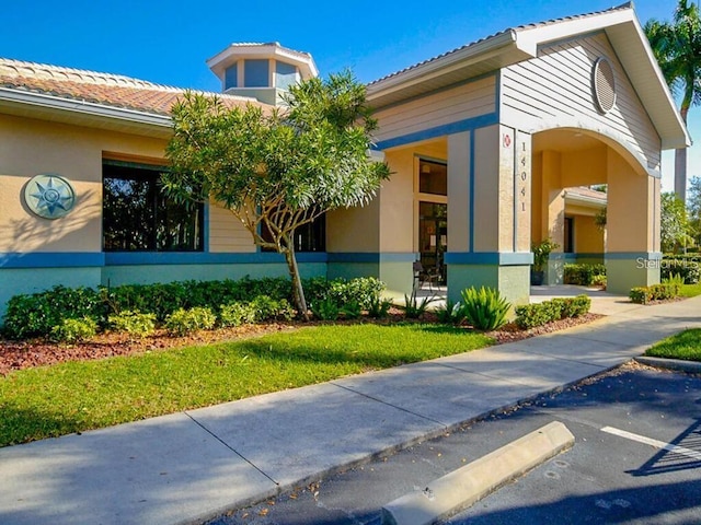 14061 Brant Point Cir Unit 7206, Fort Myers, FL 33919 - view of property featuring uncovered parking