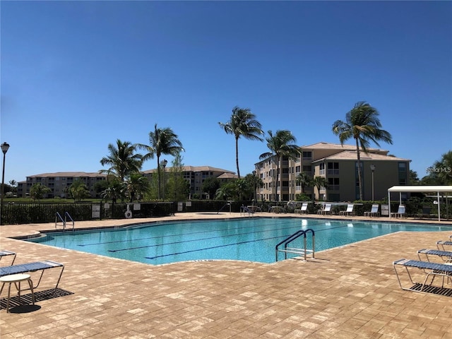 14061 Brant Point Cir Unit 7206, Fort Myers, FL 33919 - community pool featuring a patio area