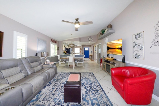1115 San Cristobal Ave, Punta Gorda, FL 33983 - living area with vaulted ceiling, ceiling fan, and light tile patterned flooring