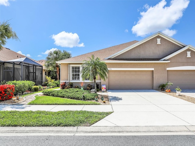 4180 Lenox Blvd, Venice, FL 34293 - ranch-style home with stucco siding, driveway, and an attached garage