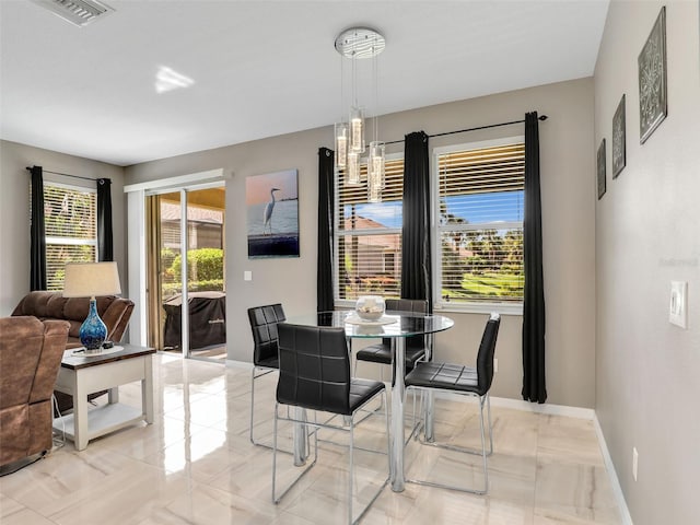 4180 Lenox Blvd, Venice, FL 34293 - dining room with baseboards
