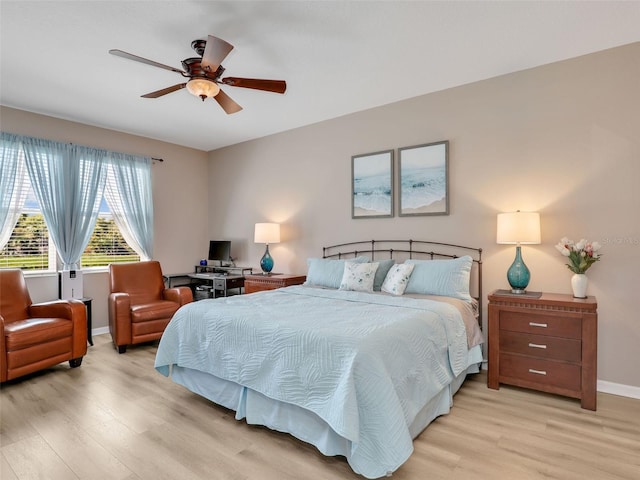 4180 Lenox Blvd, Venice, FL 34293 - bedroom with light wood-style flooring and a ceiling fan