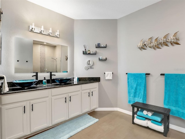 4180 Lenox Blvd, Venice, FL 34293 - bathroom featuring double vanity and an enclosed shower