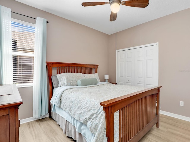 4180 Lenox Blvd, Venice, FL 34293 - bedroom with light wood-type flooring, a closet, and a ceiling fan