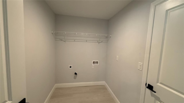 7052 Legion St, Port Charlotte, FL 33981 - washroom featuring washer hookup, light wood finished floors, and electric dryer hookup