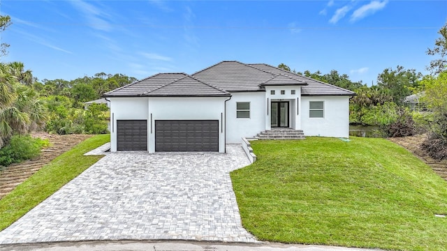 576 Mcdill Dr, Port Charlotte, FL 33953 - modern home with a garage, a front yard, stucco siding, and decorative driveway