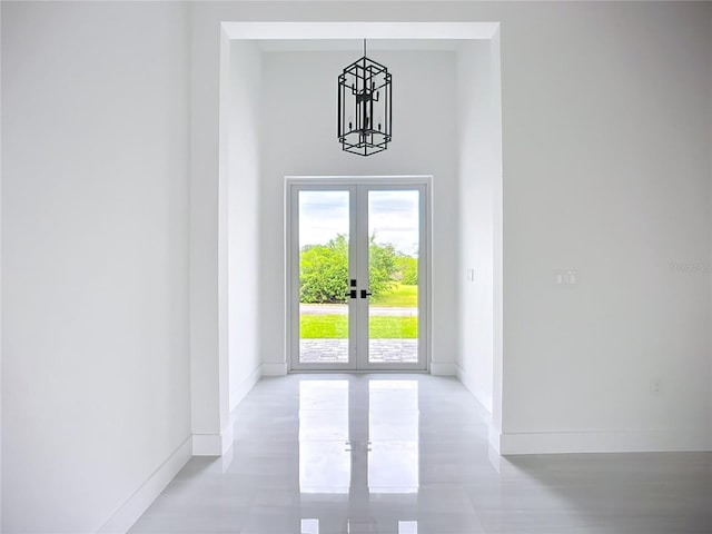 576 Mcdill Dr, Port Charlotte, FL 33953 - entryway featuring french doors, a chandelier, and a towering ceiling