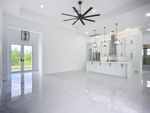 576 Mcdill Dr, Port Charlotte, FL 33953 - unfurnished living room with recessed lighting, a raised ceiling, and french doors