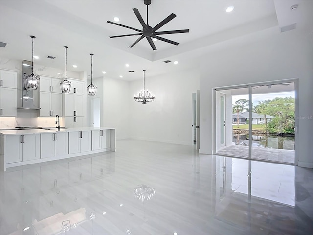 576 Mcdill Dr, Port Charlotte, FL 33953 - kitchen with exhaust hood, recessed lighting, light countertops, a large island, and white cabinets