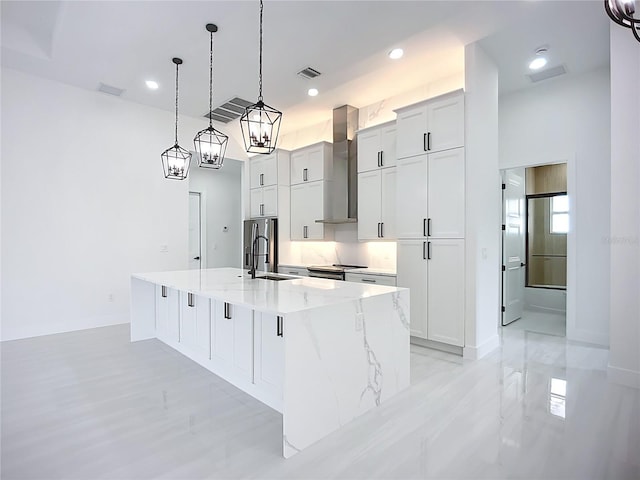 576 Mcdill Dr, Port Charlotte, FL 33953 - kitchen featuring wall chimney range hood, stainless steel fridge with ice dispenser, a large island, pendant lighting, and recessed lighting