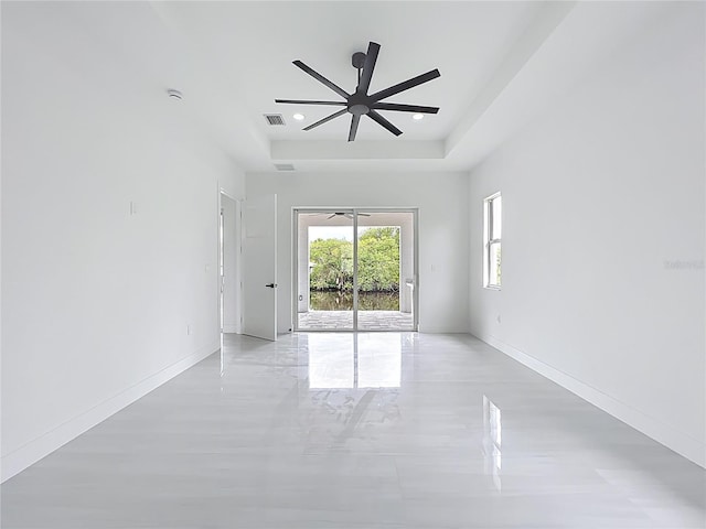 576 Mcdill Dr, Port Charlotte, FL 33953 - unfurnished room with a raised ceiling, a ceiling fan, recessed lighting, and a smoke detector