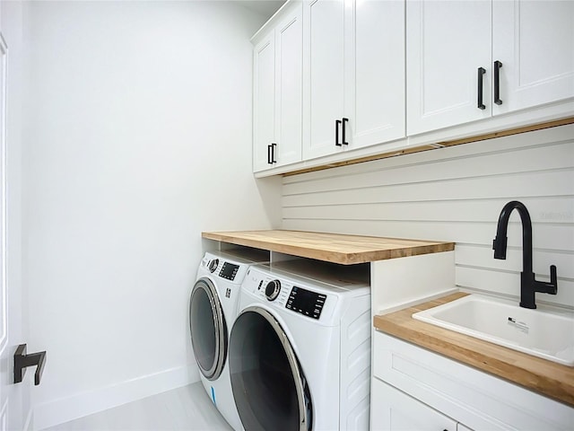 576 Mcdill Dr, Port Charlotte, FL 33953 - laundry area featuring washer and clothes dryer and cabinet space