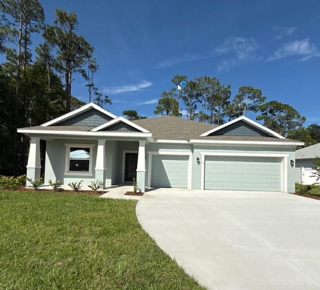 41 Fountain Gate Ln, Palm Coast, FL 32137 - view of front of home featuring a garage, concrete driveway, a front yard, and stucco siding
