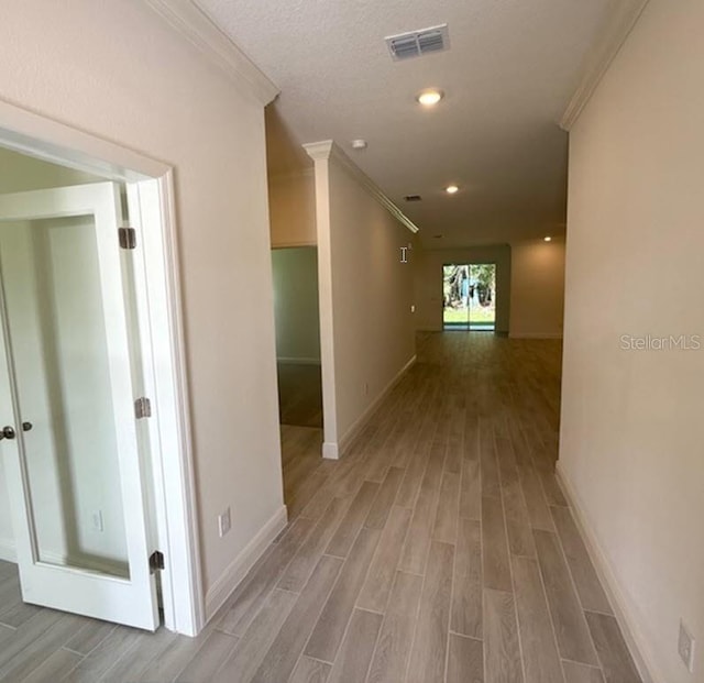 41 Fountain Gate Ln, Palm Coast, FL 32137 - corridor with crown molding, wood finished floors, and recessed lighting