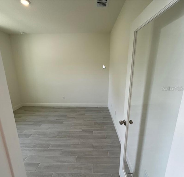 41 Fountain Gate Ln, Palm Coast, FL 32137 - unfurnished room with wood finished floors and recessed lighting
