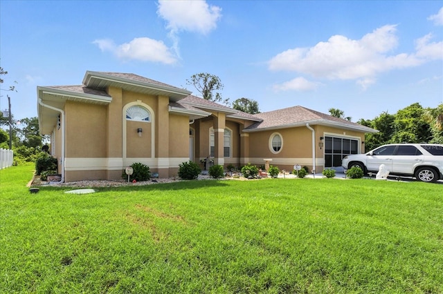 2329 Como St, Port Charlotte, FL 33948 - view of front of house with a garage, stucco siding, and a front yard