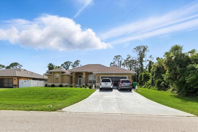 2329 Como St, Port Charlotte, FL 33948 - view of front of property with a garage, a front yard, concrete driveway, and stucco siding