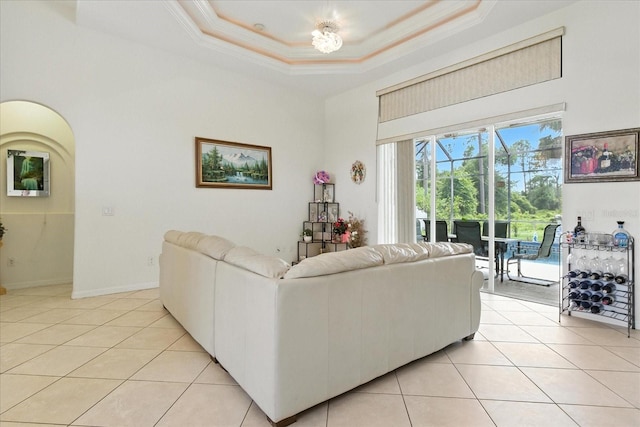 2329 Como St, Port Charlotte, FL 33948 - living room with light tile patterned flooring, crown molding, a tray ceiling, and a high ceiling