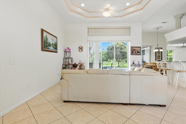 2329 Como St, Port Charlotte, FL 33948 - living area with healthy amount of natural light, light tile patterned flooring, recessed lighting, crown molding, and a raised ceiling