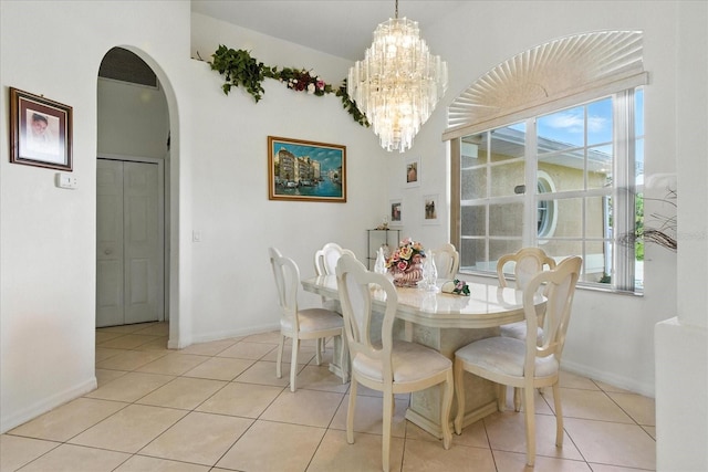 2329 Como St, Port Charlotte, FL 33948 - dining space with arched walkways, a chandelier, and light tile patterned flooring