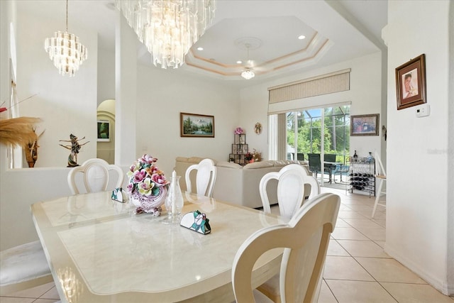 2329 Como St, Port Charlotte, FL 33948 - dining area featuring light tile patterned floors, a chandelier, a tray ceiling, and recessed lighting