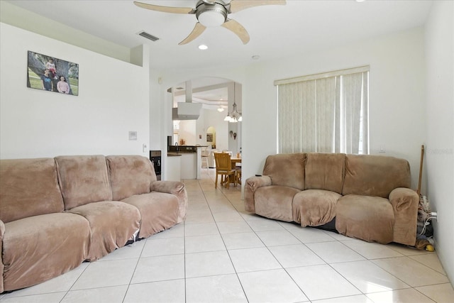 2329 Como St, Port Charlotte, FL 33948 - living area featuring light tile patterned floors, a ceiling fan, arched walkways, and recessed lighting